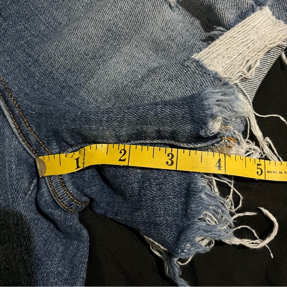 Risen high rise. Distressed jean shorts. - Picture 8 of 9